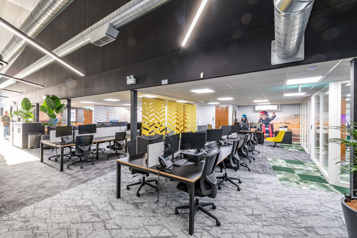 Stylish and contemporary office lounge in Harlaxton House with vibrant decor, natural light, and comfortable seating, designed to foster creativity and collaboration among professionals in the East Midlands.